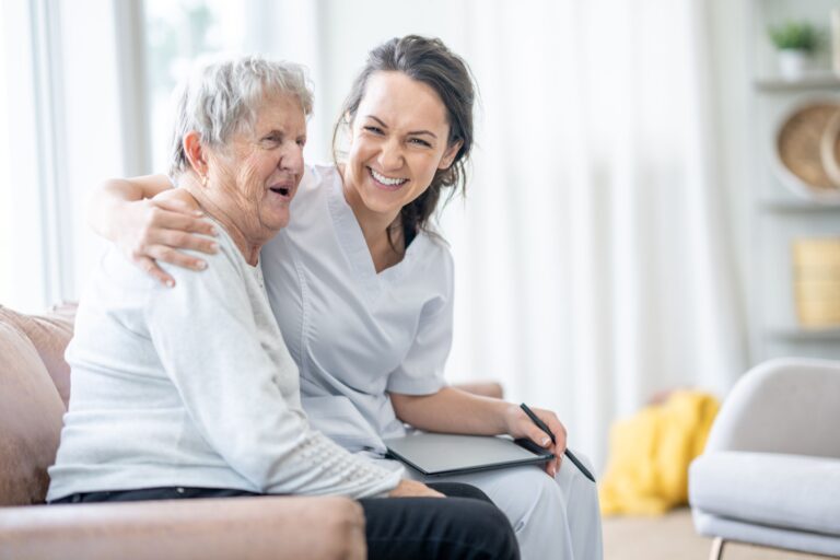 Caregiver laughing with patient